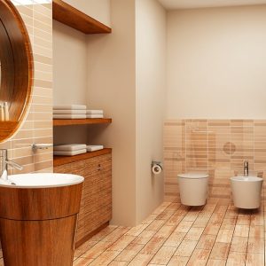 Bagno moderno con sanitari tondeggianti, piastrelle beige e pavimento in grès effetto legno